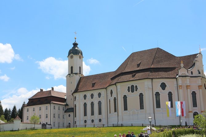 From Fussen: Neuschwanstein, Linderhof and More Private Tour - Oberammergau: lunch, wood carvings, and painted house hunting