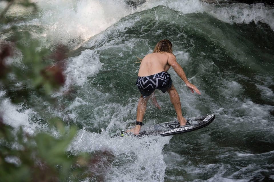 Munich: Eisbachwelle River Surfing Experience - Cold water reality: wetsuits, booties, and pacing your nerves