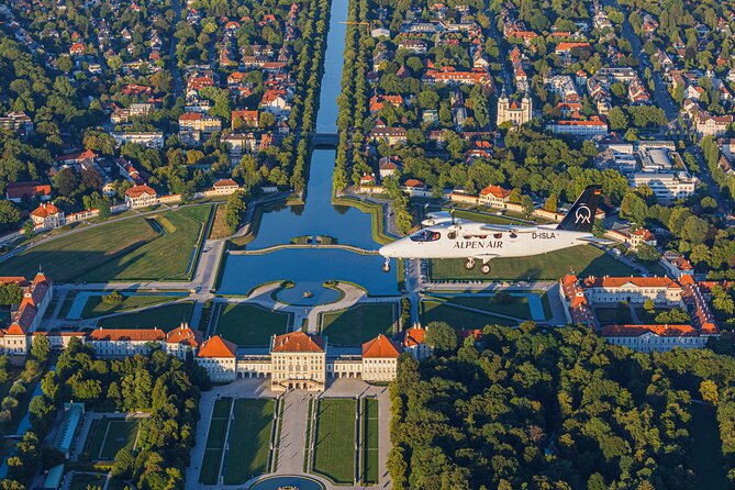 Sightseeing flight Zugspitze Neuschwanstein Castle Alps Munich Augsburg - Neuschwanstein from the air: Lake Forggensee adds the fairy-tale framing